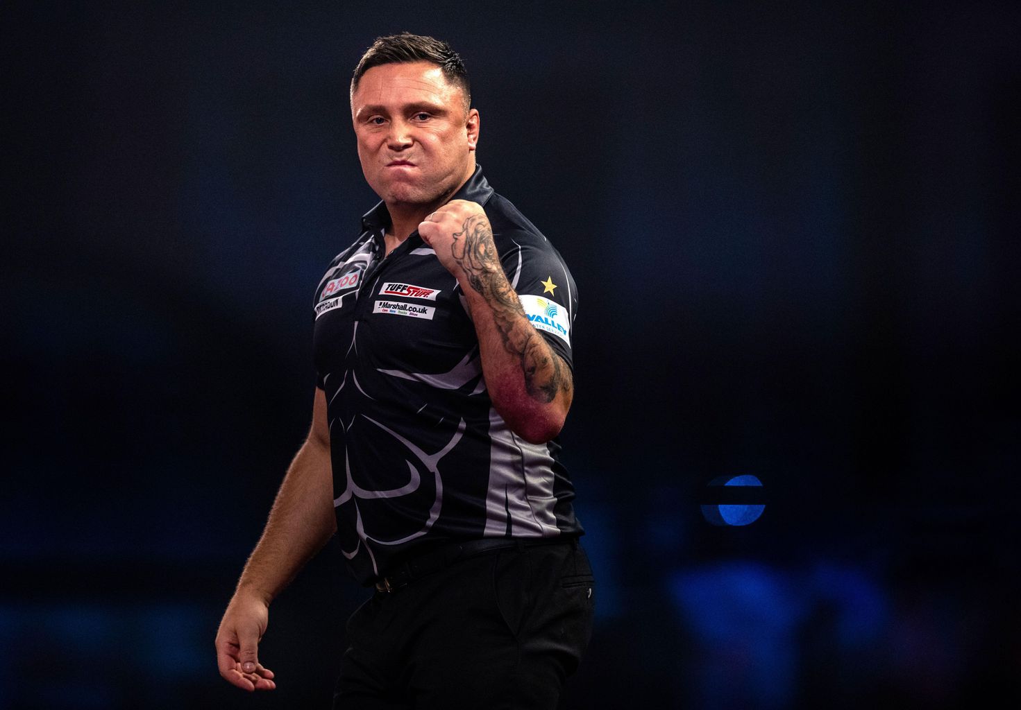 Gerwyn Price wears ear defenders during PDC World Championship quarter